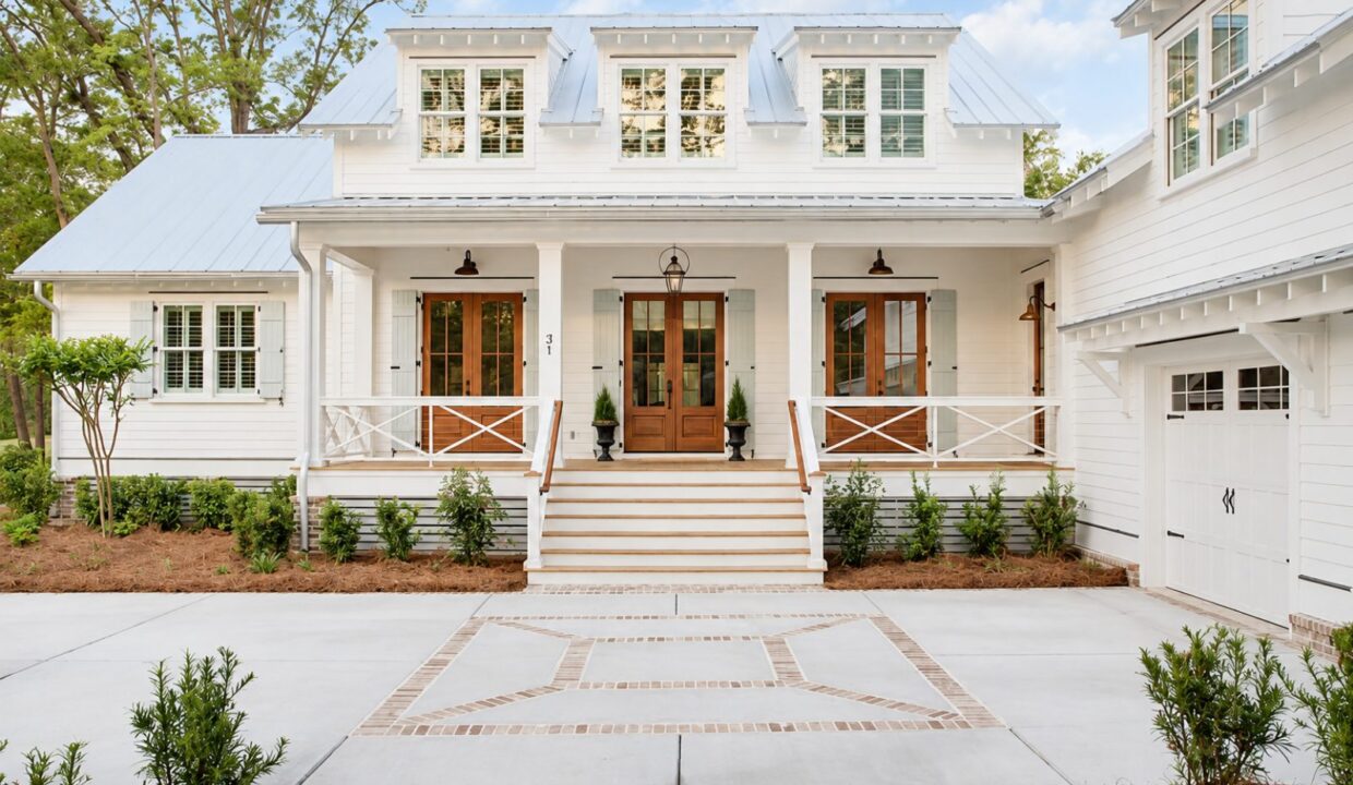White cottage-style home exterior with a covered porch
